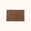 A rectangular brown and natural mat with a geometric pattern.