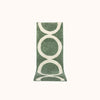A green and tan geometric designed bath mat made of plush tufted cotton.