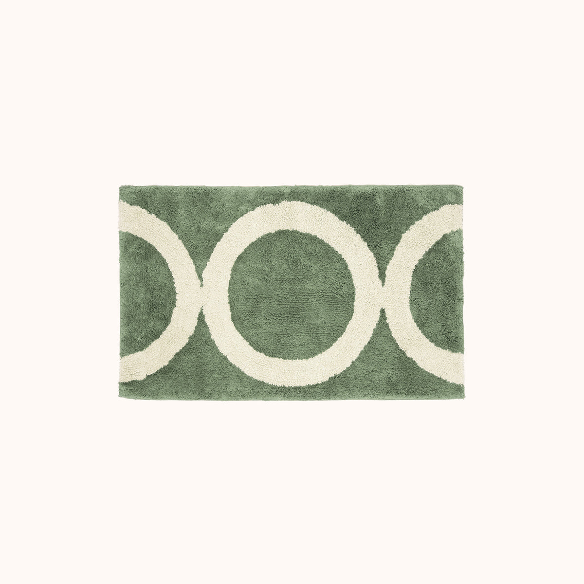 A green and beige geometric designed bath mat.