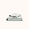 A folded organic matte sateen Mist sheet set, displayed on a white background.