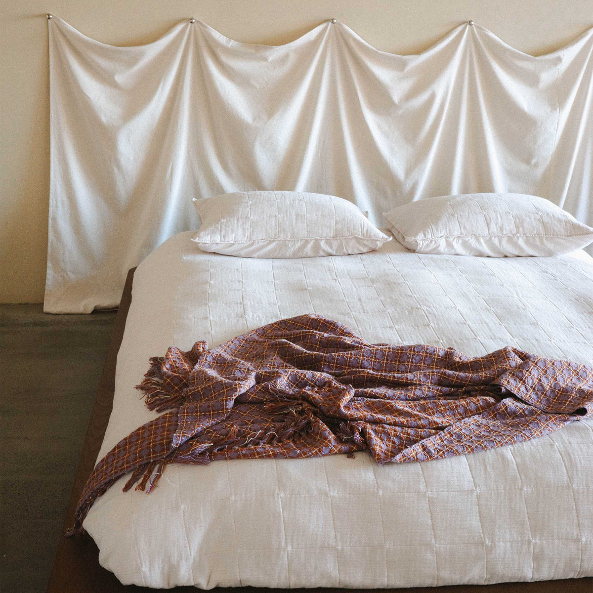 Another angle of the bright white bed this time, the Rosina is crumpled casually at the foot of the bed