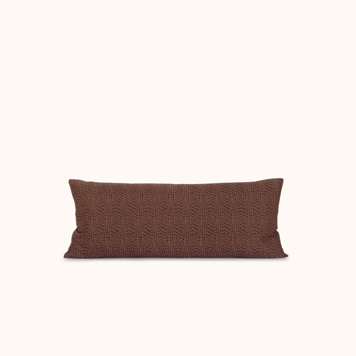 Brown lumbar pillow on a white background