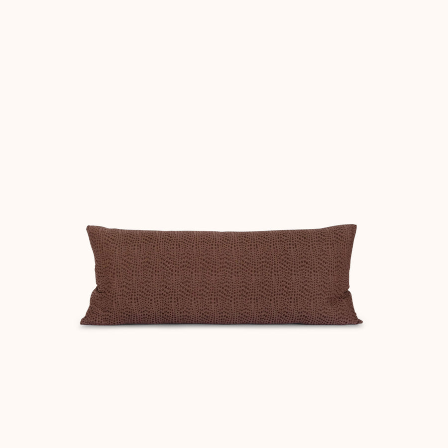 Brown lumbar pillow on a white background