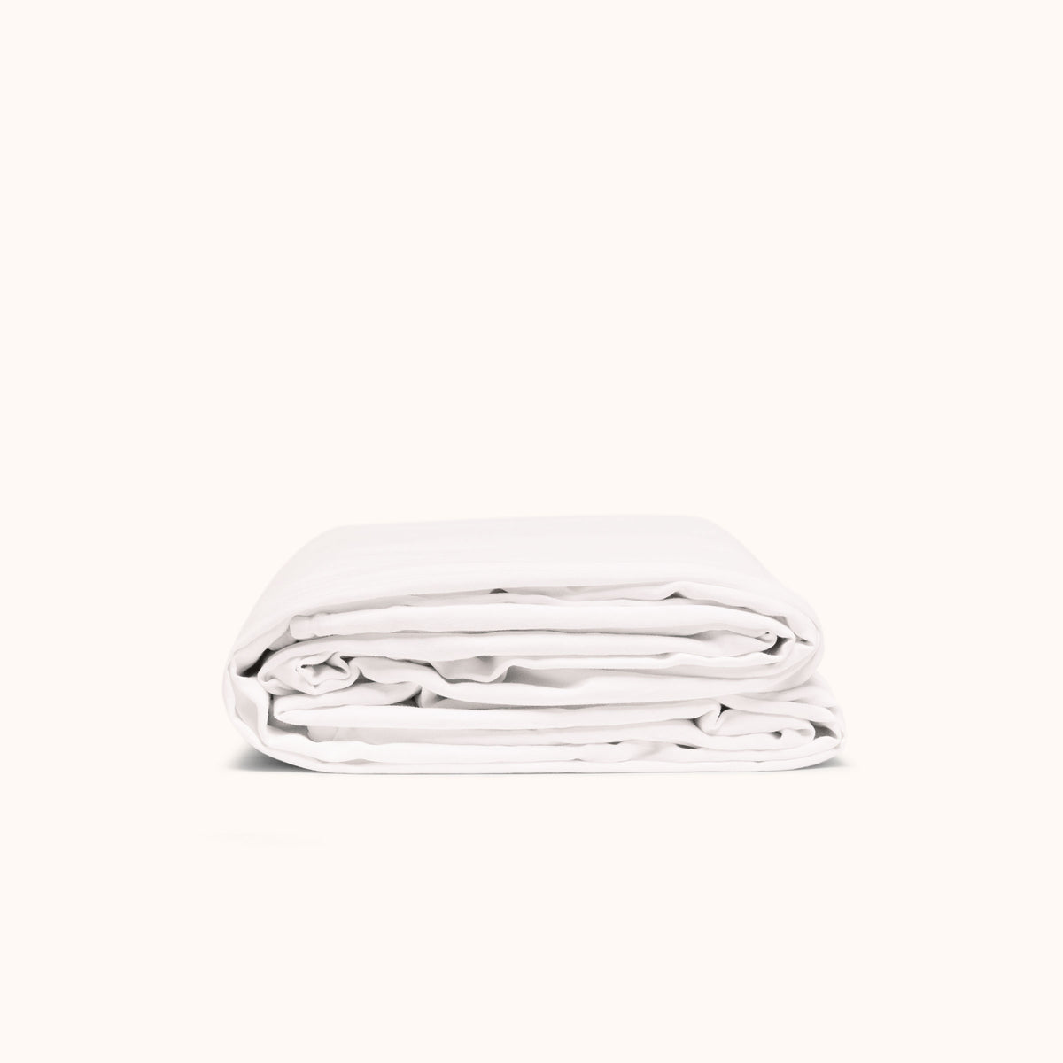 A folded white duvet cover made of matte sateen, displayed against a white background.
